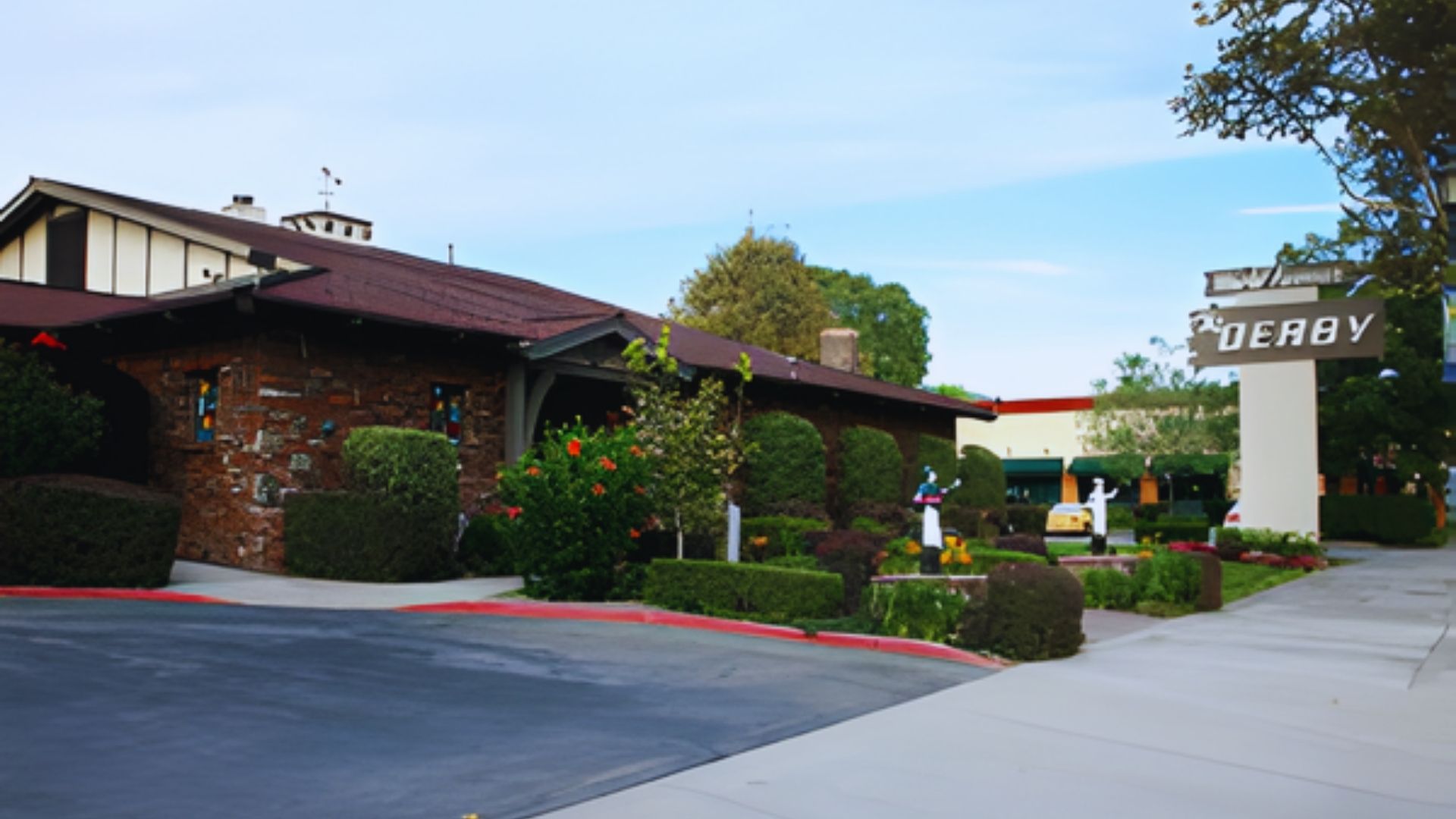 A large building featuring a prominent sign on its facade, indicating its purpose or name.
