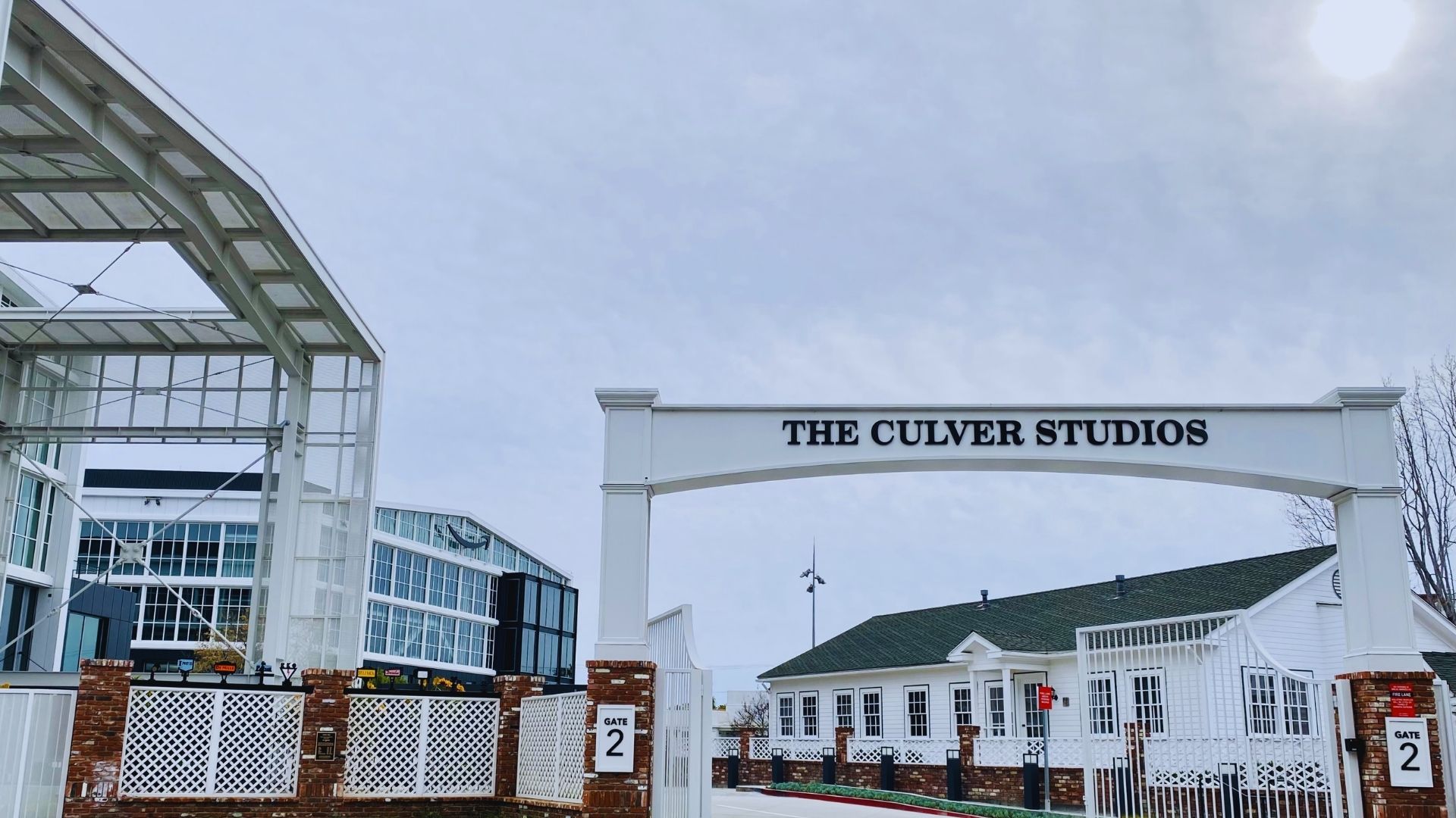 The Oliver Studios building in Charleston, SC, showcasing its modern architecture against a city backdrop.
