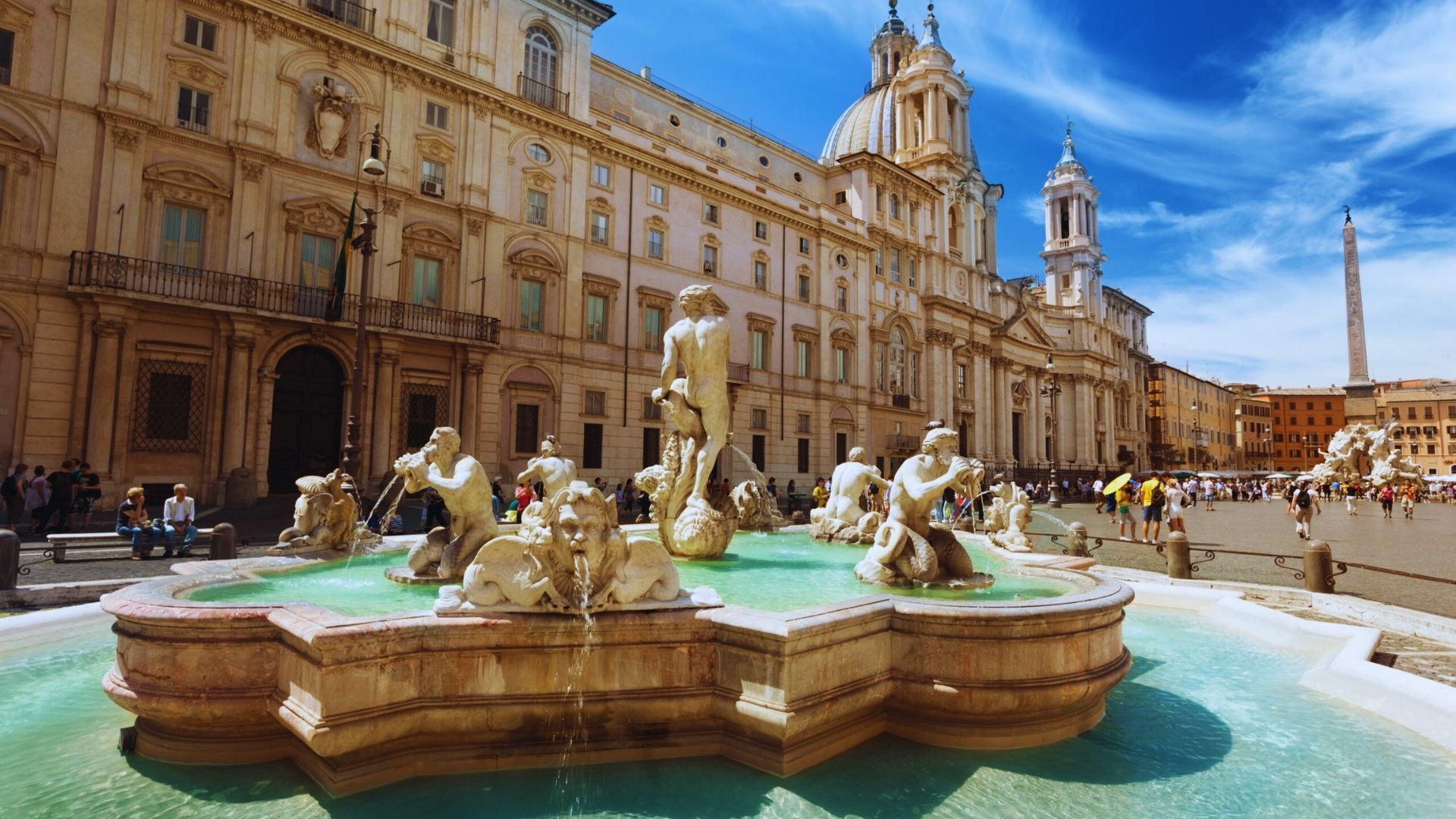 Fountain in front of the Piazza del Ponte, showcasing classic Roman architecture and vibrant surroundings in Rome, Italy.
