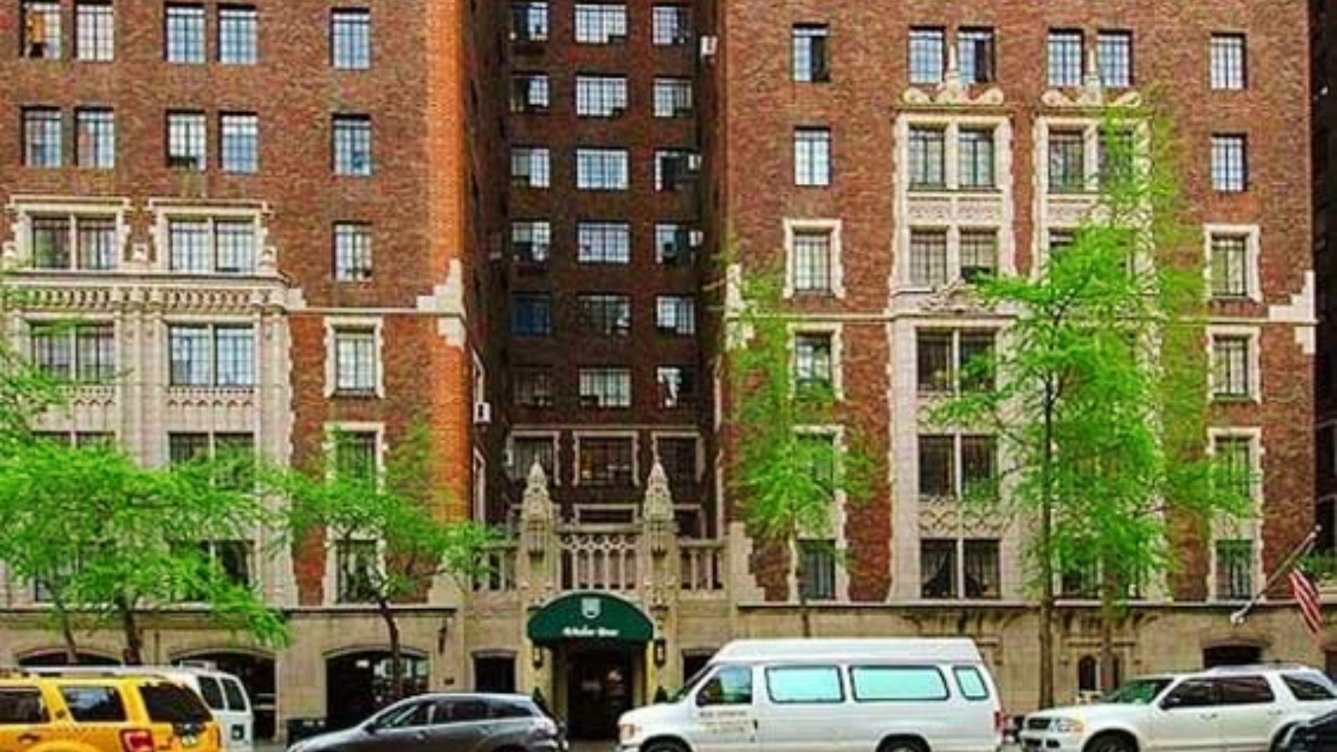 A historic brick building with many cars in front, recognized for its role in the filming of Scarface.
