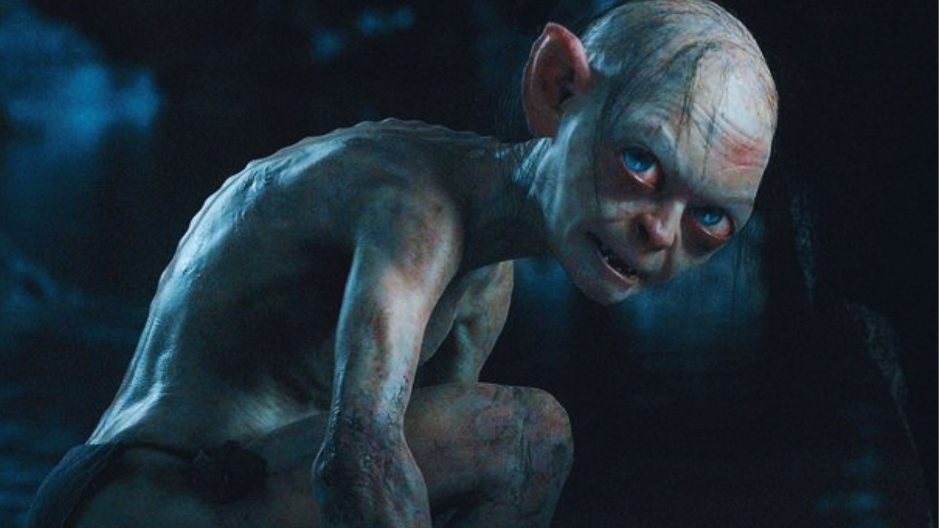 A creature with pale skin and large eyes crouches in a dark, cave-like environment. Its expression is intense and eerie, evoking a sense of mystery and tension.