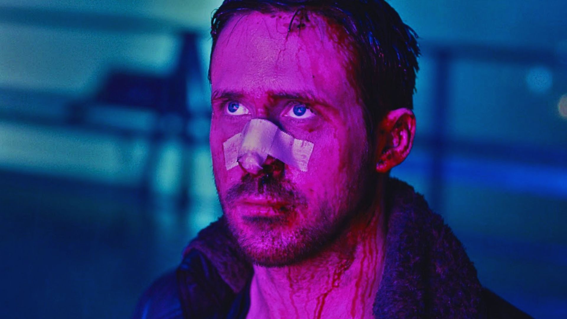 A man with a bandaged nose and blood on his face looks upward. The lighting is a dramatic mix of pink and blue, creating an intense, somber mood.