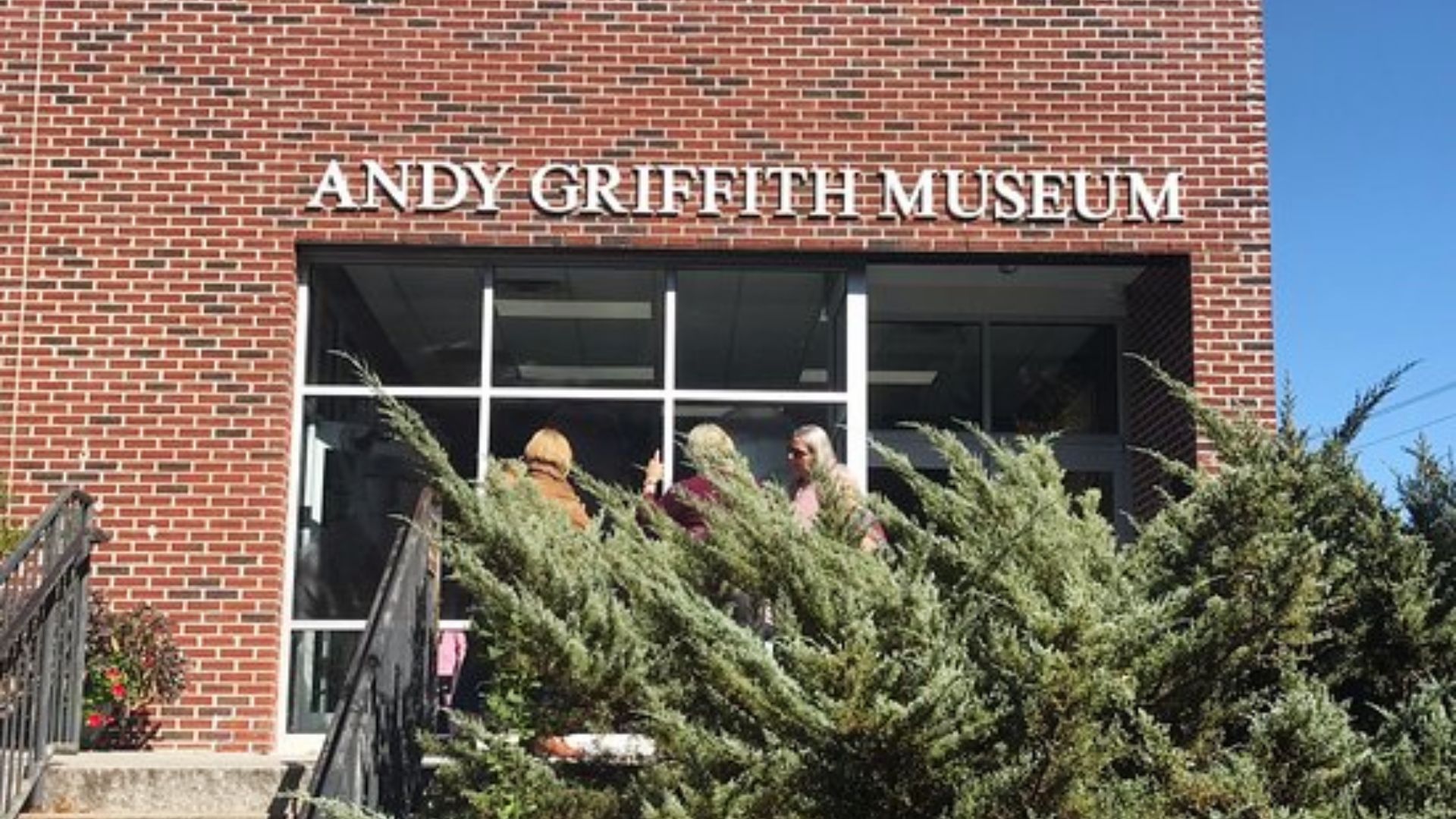 Red brick building with large windows and “Andy Griffith Museum” signage above the entrance.