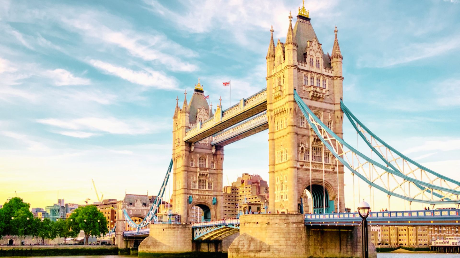 Tower Bridge at golden hour over the River Thames offers iconic views and riverside stays near historic South Bank attractions.