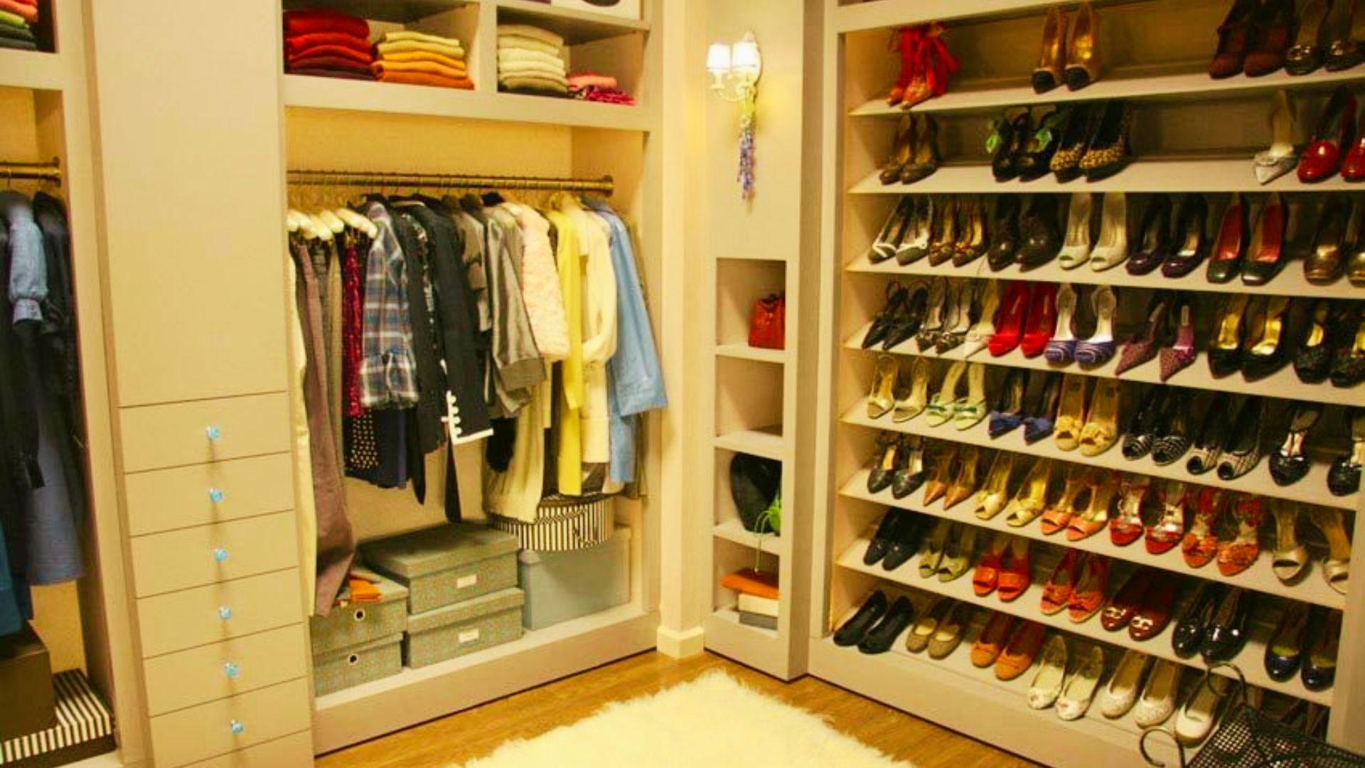Blair Waldorf’s organized walk-in closet with floor-to-ceiling shoe shelves and color-coordinated clothing.