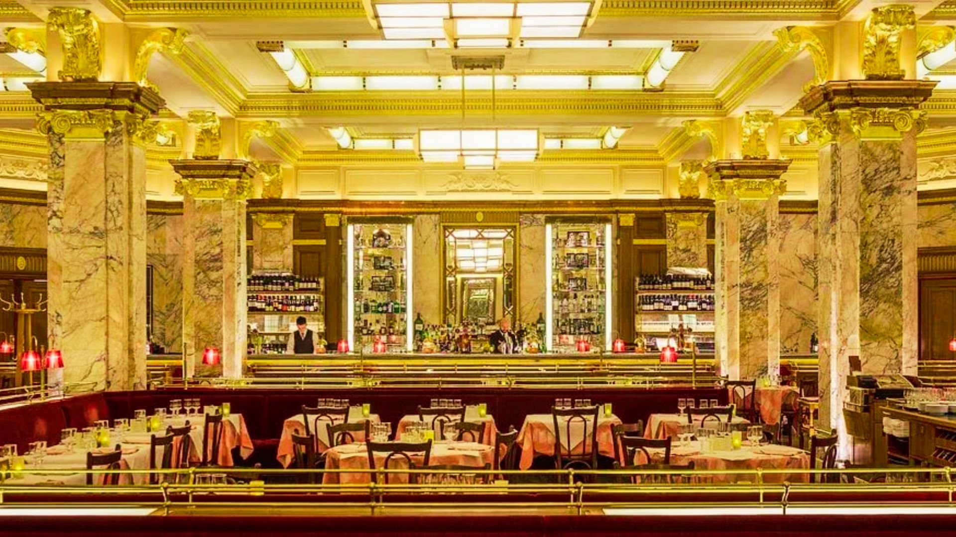 Opulent Art Deco dining room with marble columns showcases Soho’s luxury hotels, fine dining, and 5-star hospitality.