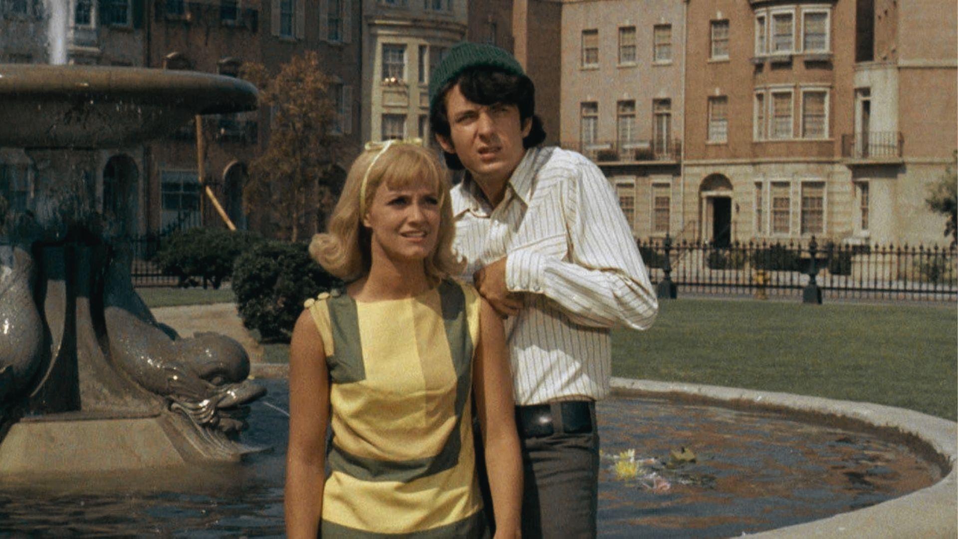 Actors pose by the “Friends fountain” on the Warner Bros. backlot, a common filming site for establishing shots.