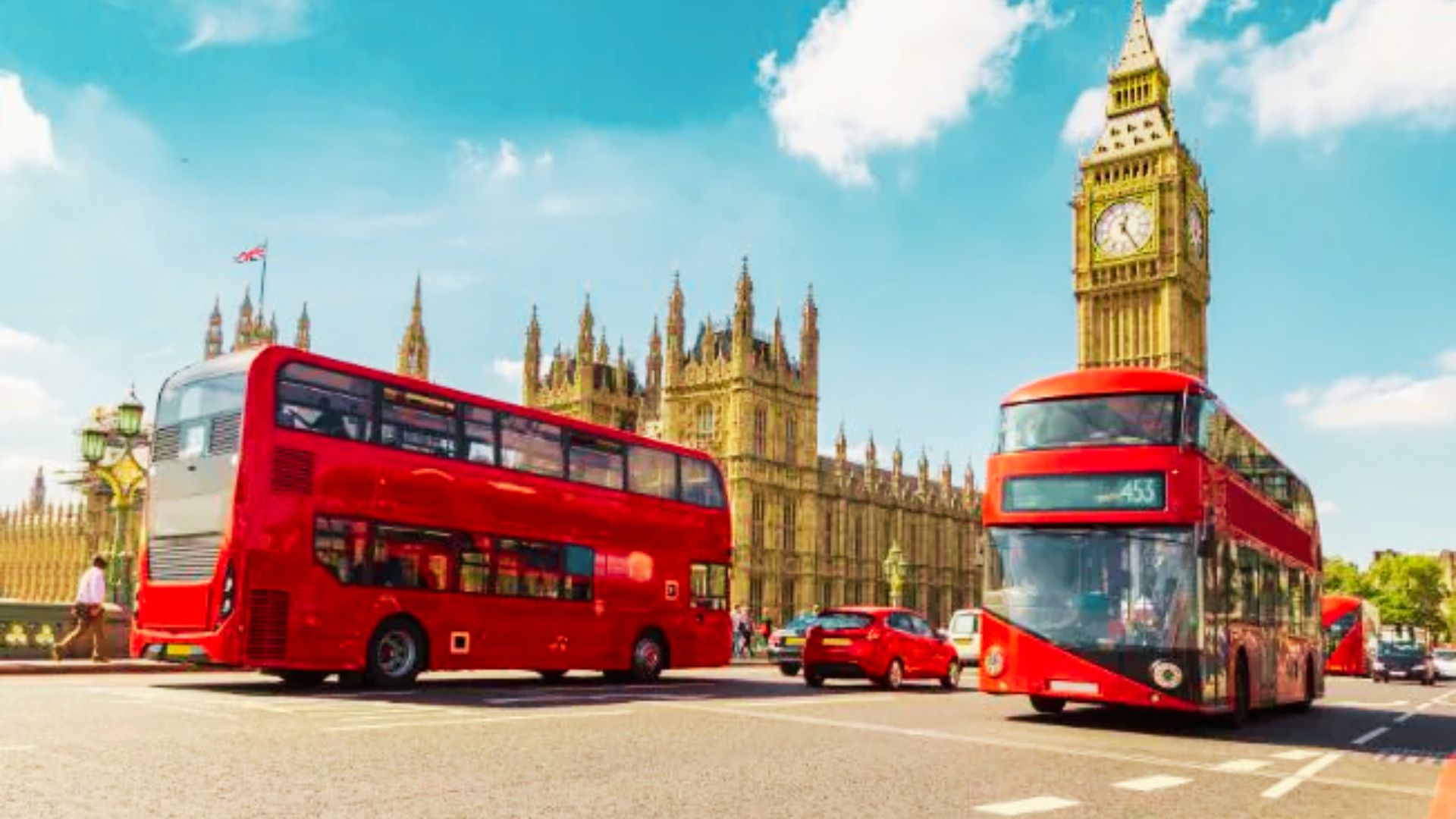 Red double-decker buses crossing Westminster Bridge with Big Ben behind offers central stays with unbeatable transport links and views.