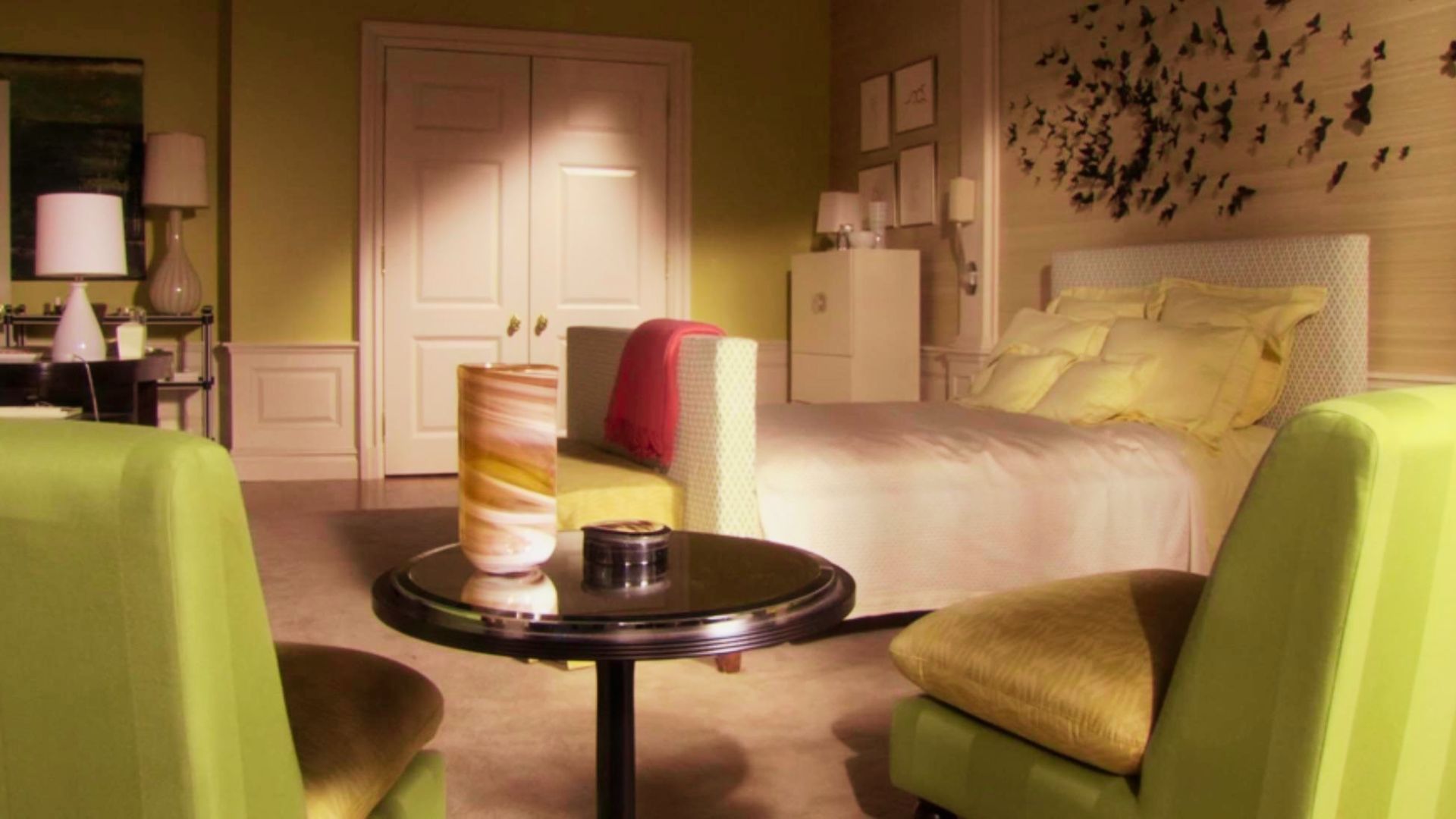 Blair bedroom with green color furniture and decoration on wall.