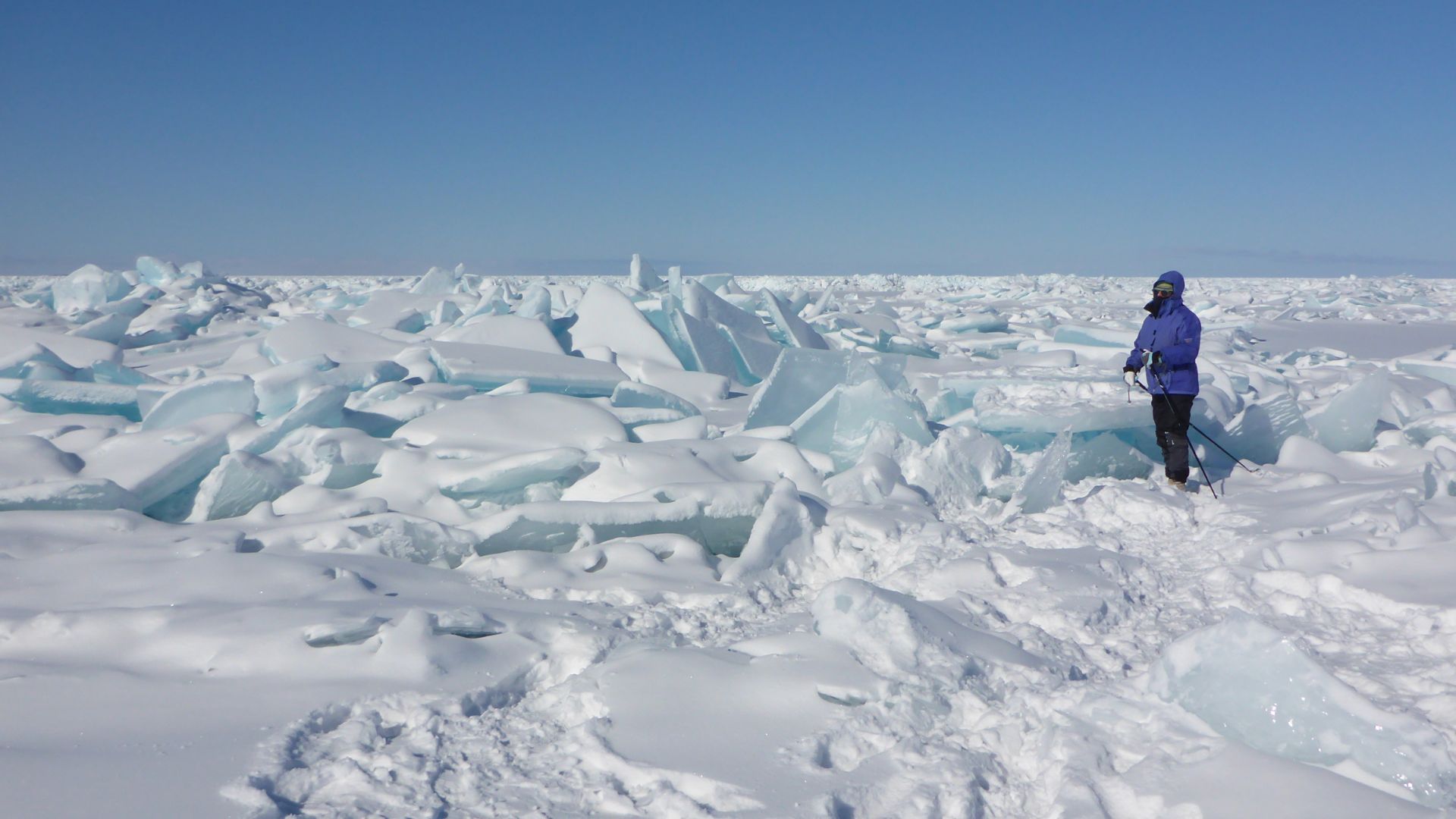 A BOY ADMIRING FROZEN LAKE
