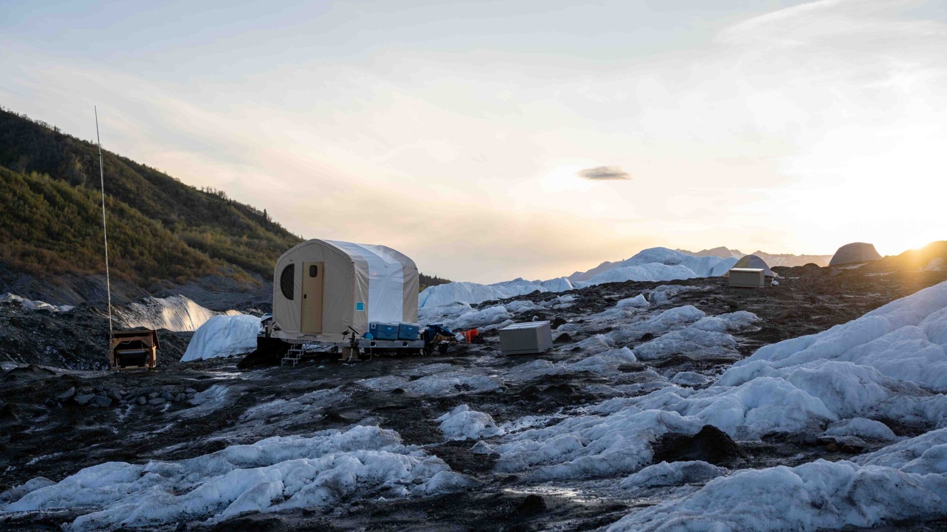 A PHOTO OF A CAMPING TENT ON A REMOTE ALASKAN GLACIER
