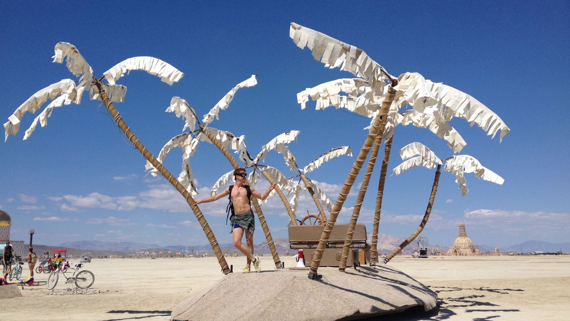 A MAN ADMIRING DESERT ART
