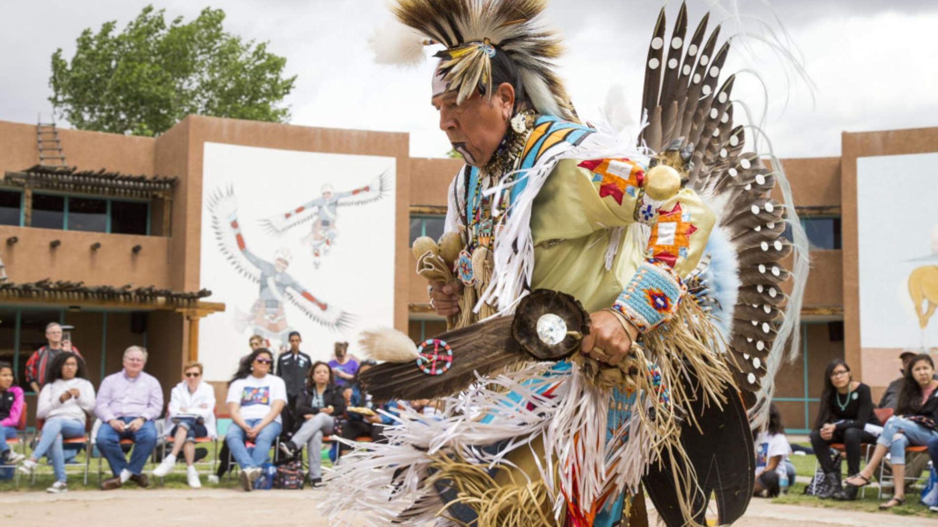 A MAN PERFORMING TRADITIONAL DANCE 
