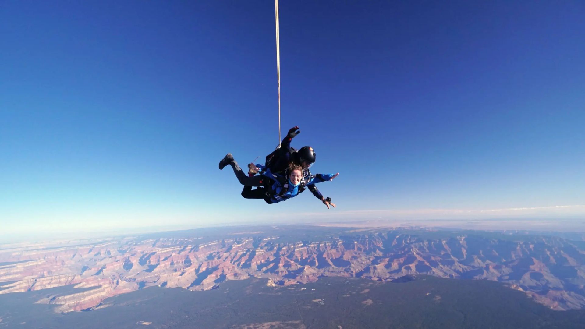 PEOPLE SKYDIVING OVER THE GRAND CANYON
