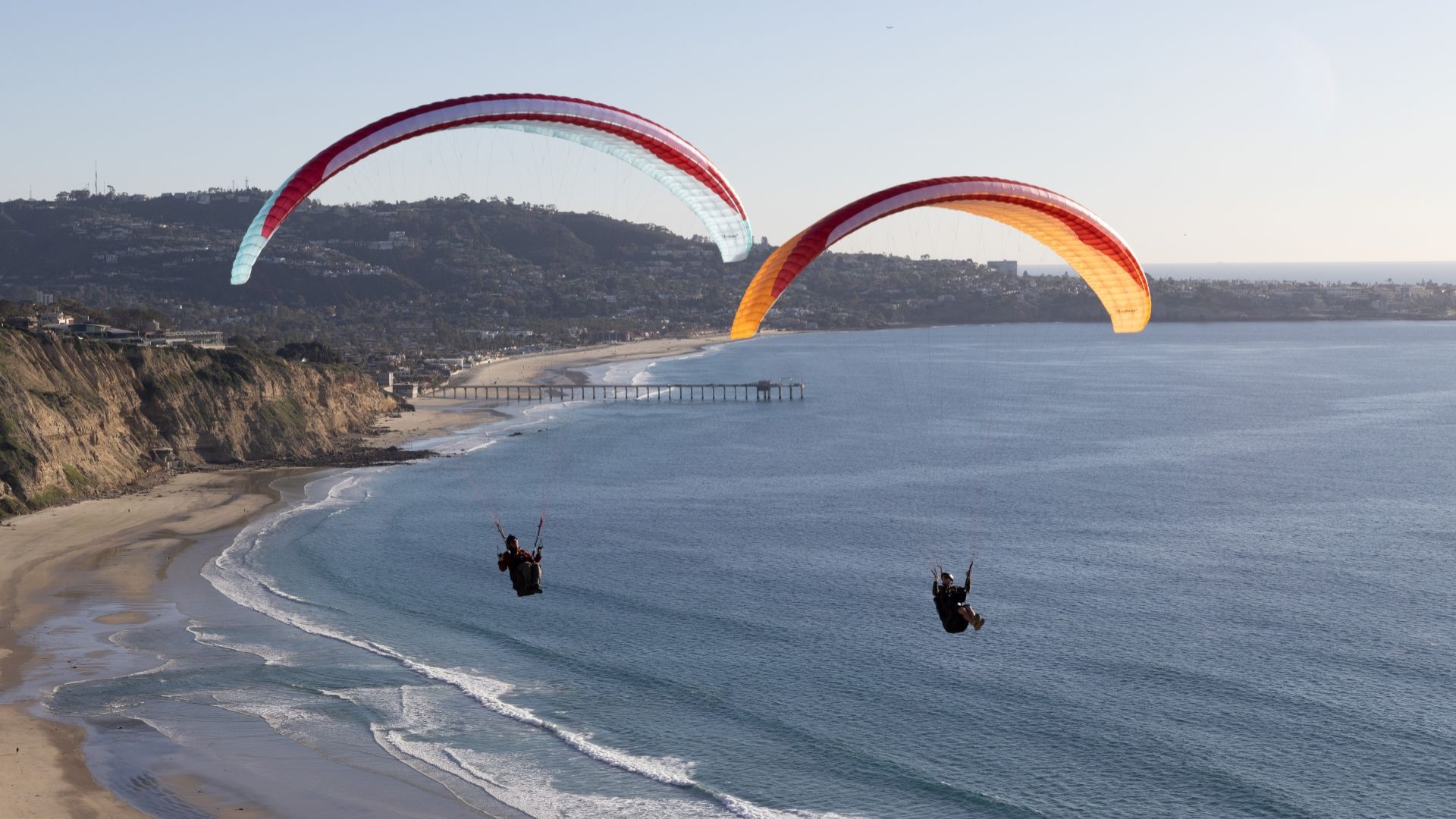 A PHOTO OF PEOPLE EXPERIENCING PARAGLIDING
