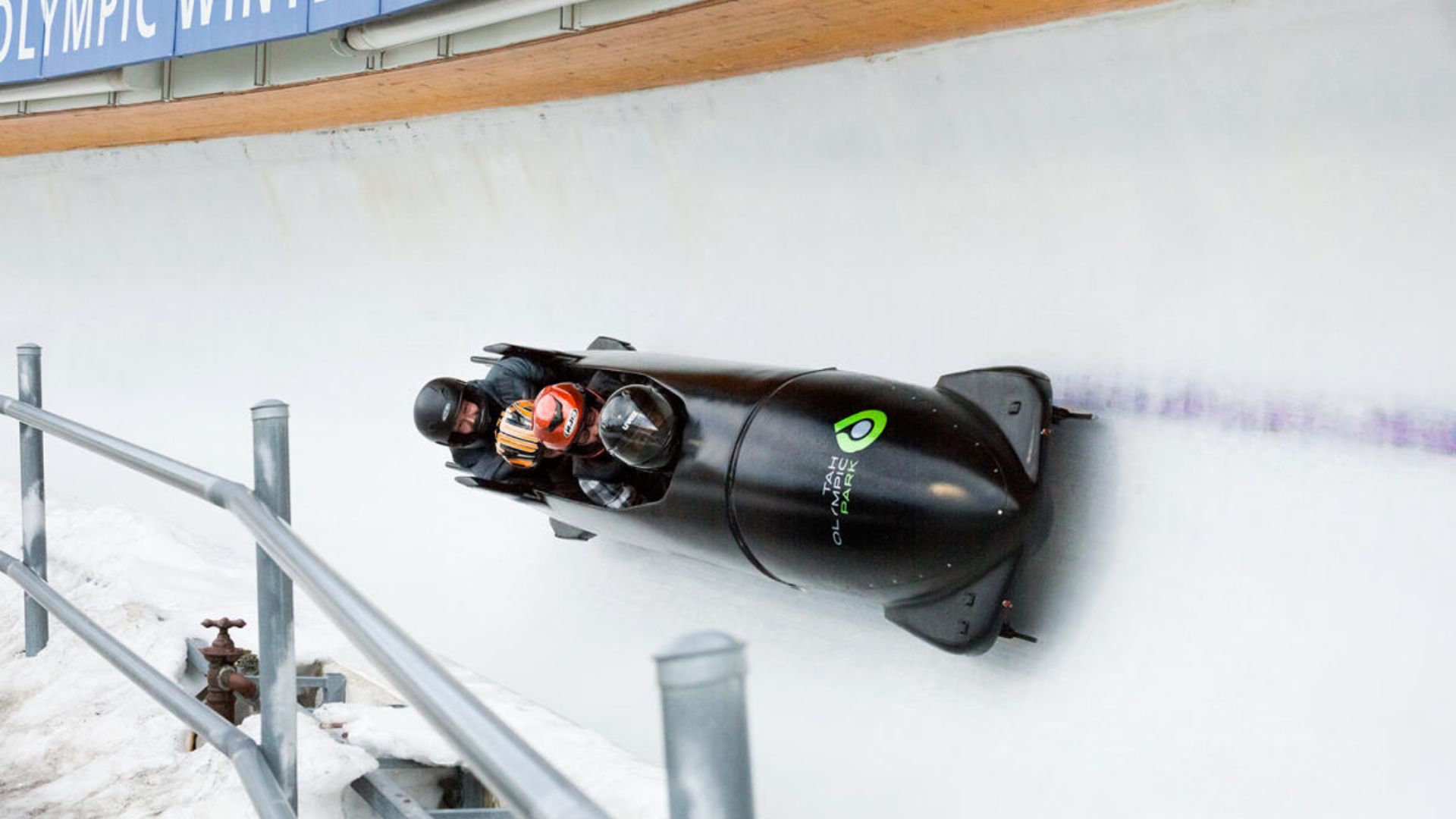 A PHOTO OF A PEOPLE HAVING BOBSLED EXPERIENCE
