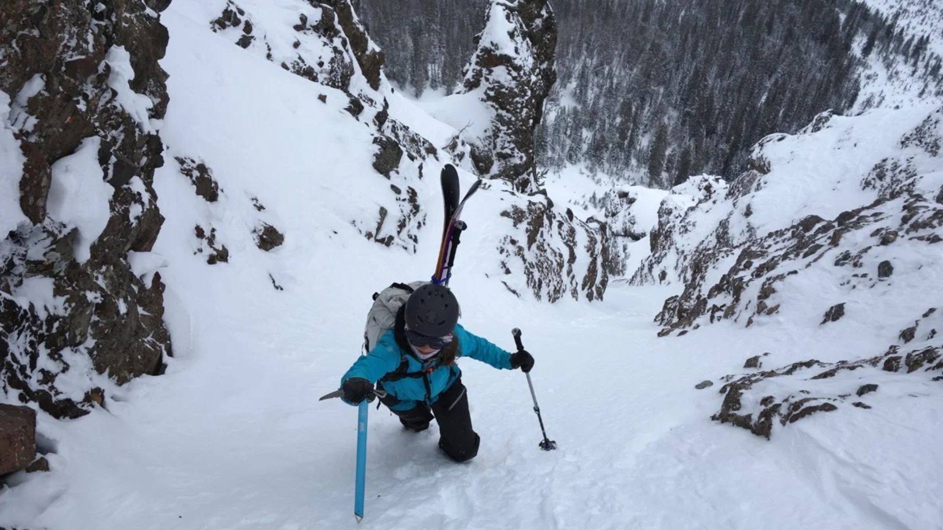 A MAN SKIING IN BACKCOUNTRY
