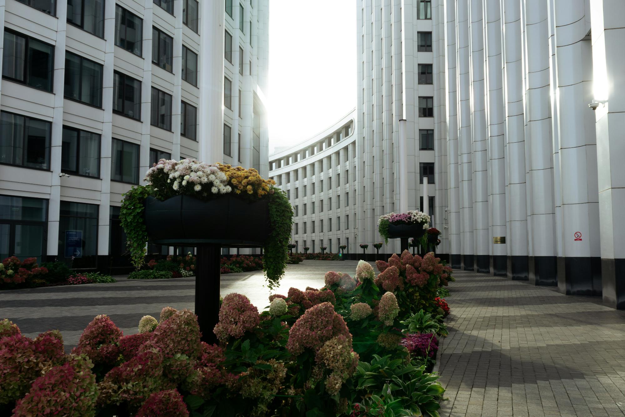 A large building featuring numerous windows, showcasing a modern architectural design.