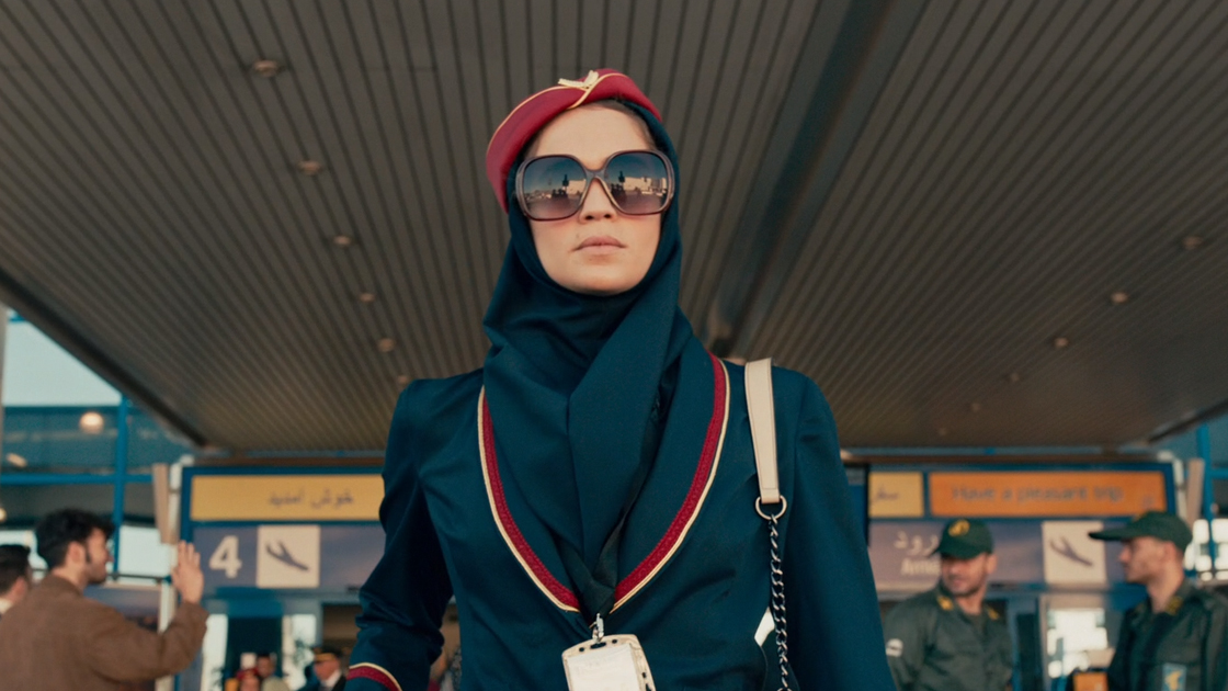Tamar arrives at an airport terminal in a scene from Tehran, filmed at Athens International Airport