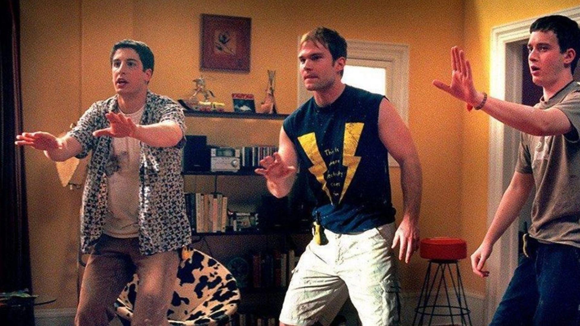 Still from American Pie 2 of 3 main leads standing in a room with hands outstretched.