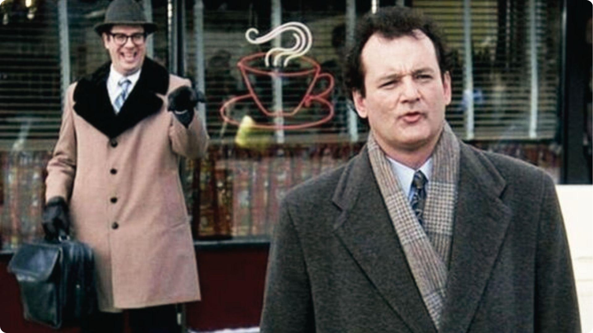 Bill Murray scowls as Ned Ryerson grins outside the cafe. “Bing!” scene, Woodstock, IL.