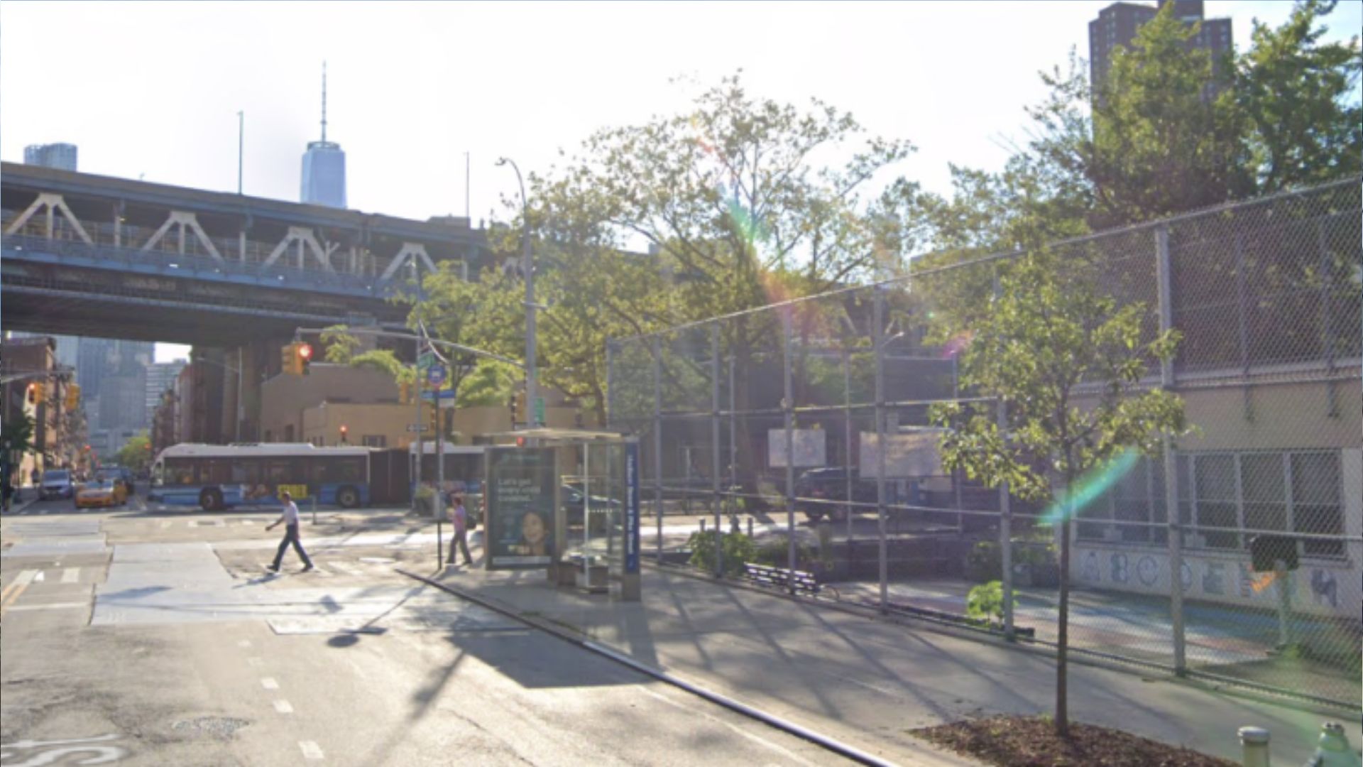 New York City street under elevated train tracks near Lower Manhattan