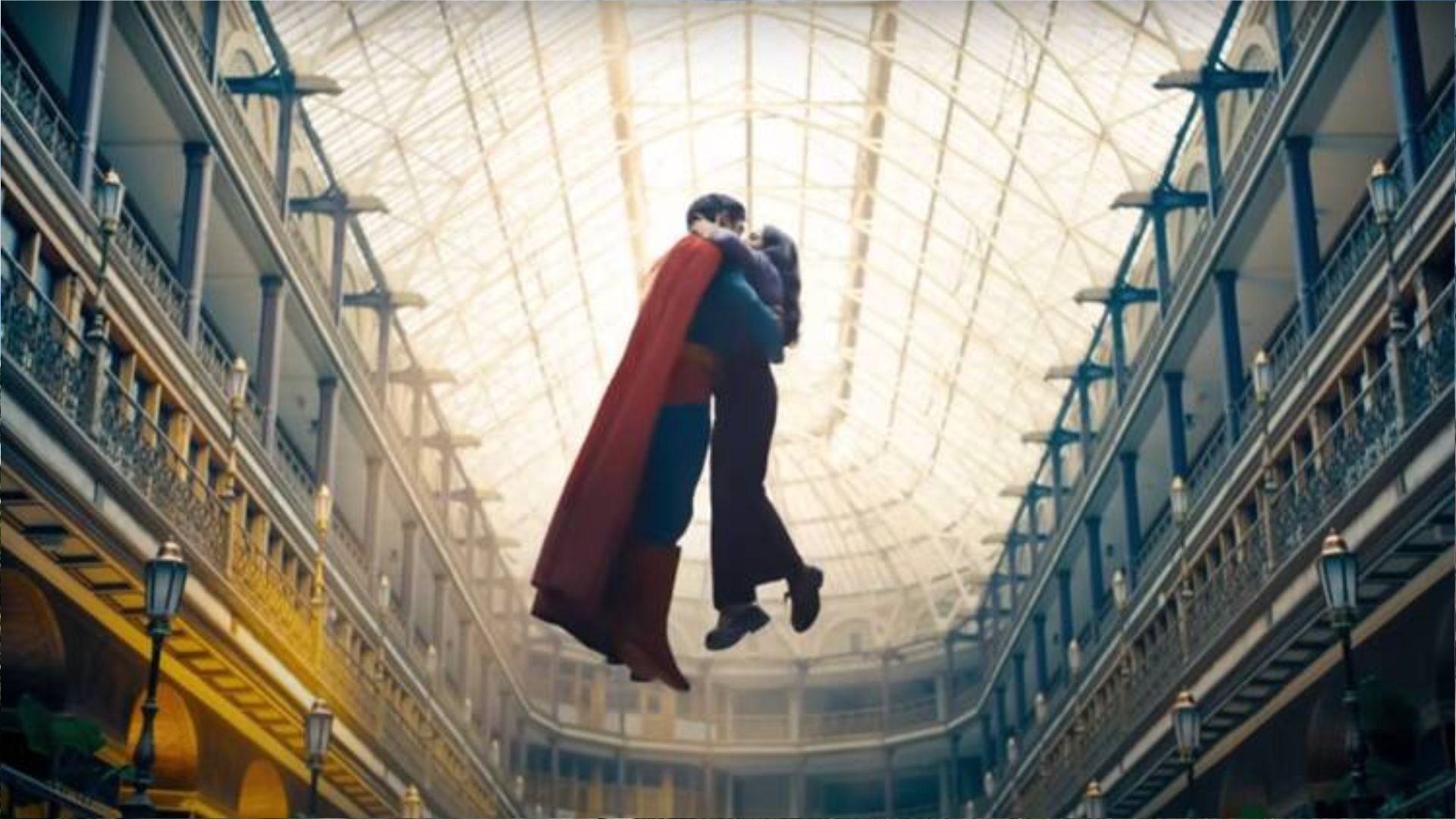 Superman and Lois Lane sharing airborne kiss inside Cleveland Arcade's glass-roofed atrium