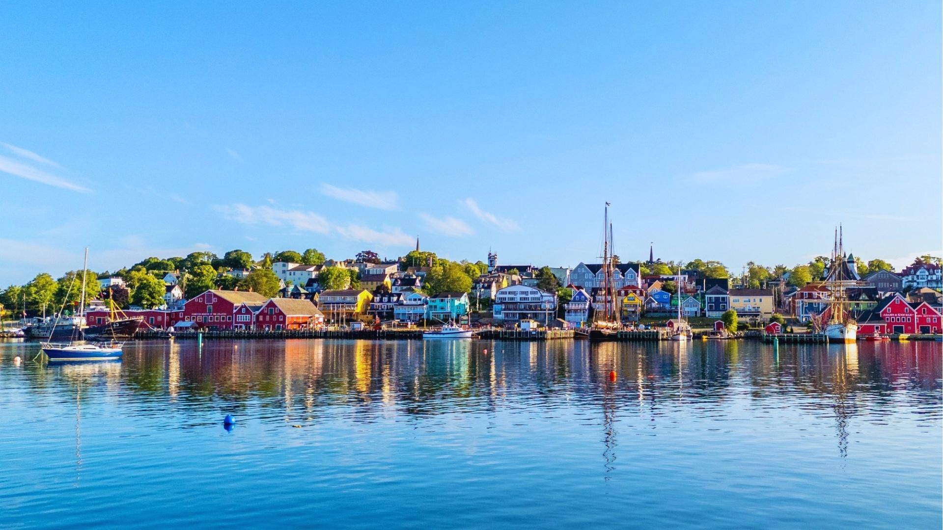 Lunenburg, Nova Scotia harbor with colorful buildings, main town location filmed for We Were Liars series.