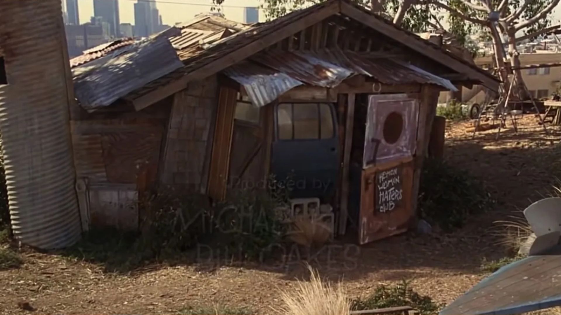 He-Man Woman Haters Club clubhouse exterior filmed at 1031 Figueroa Terrace Echo Park with Downtown Los Angeles skyline behind it