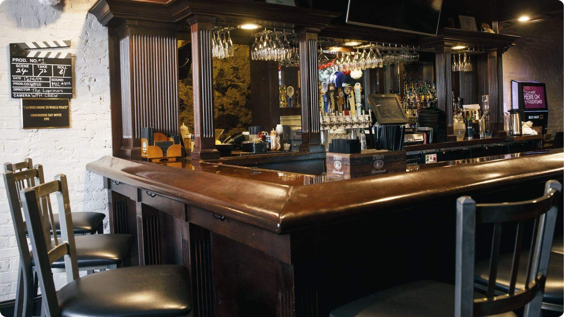 Woodstock bar interior with “I Always Drink to World Peace” plaque. Phil’s Groundhog Day toast.