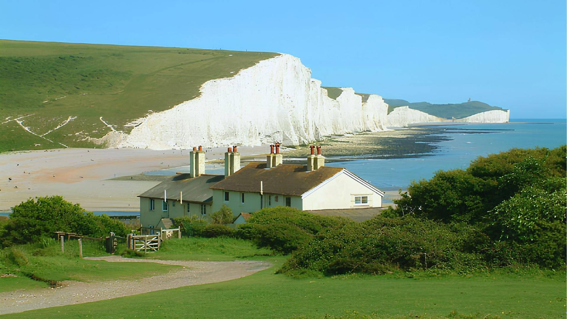 Seven Sisters chalk cliffs in Sussex, UK, filming location for Wicked’s Emerald City approach scenes.