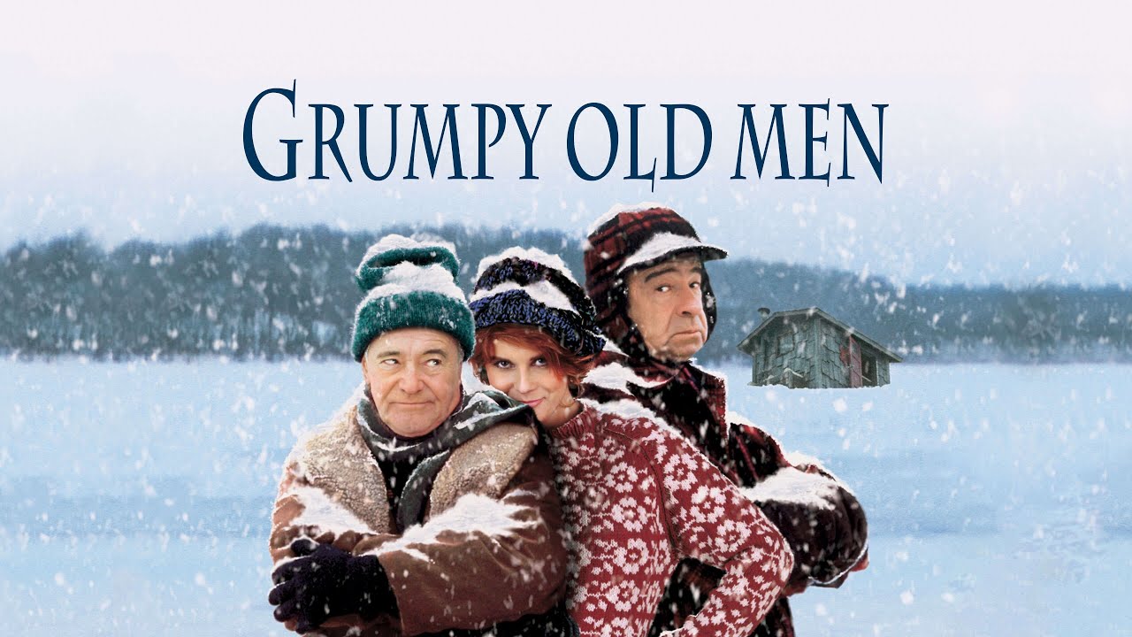 Grumpy Old Men movie poster featuring three winter-clad characters standing on a snowy frozen lake with an ice-fishing shack in the background.
