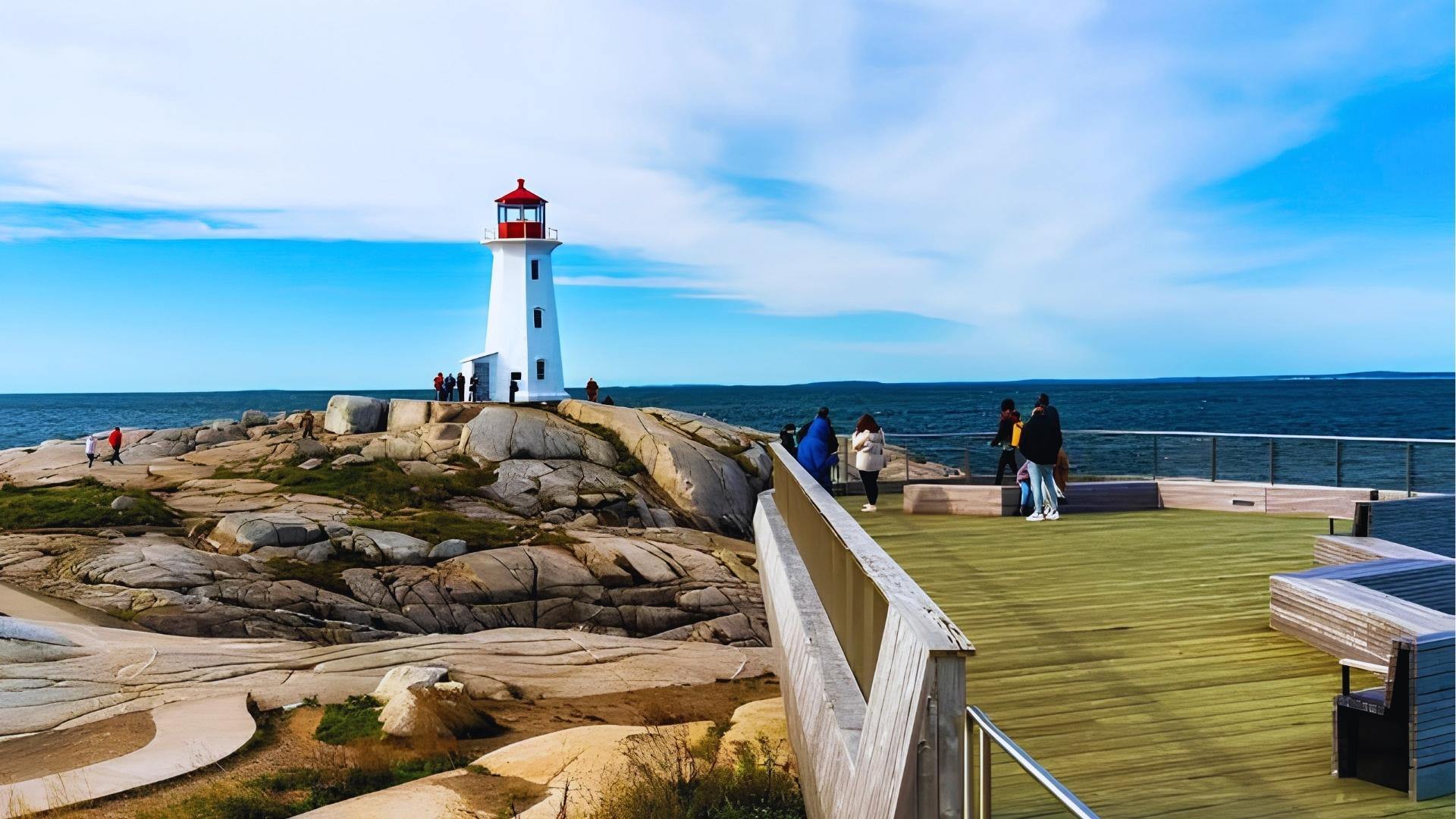 Peggy’s Cove lighthouse on granite rocks in Nova Scotia, iconic landmark near We Were Liars filming locations.