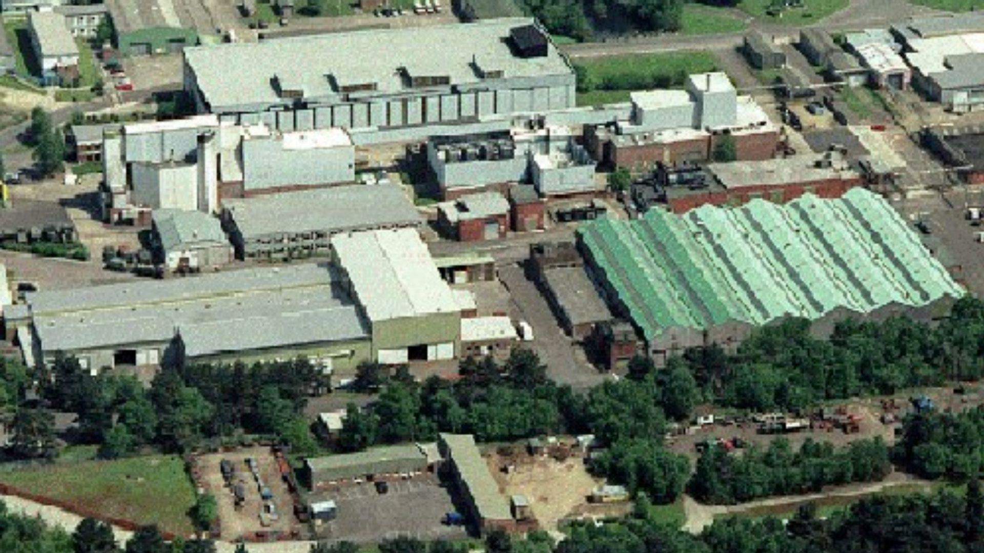 Aerial view of Longcross Studios, showing large soundstage buildings and facilities.