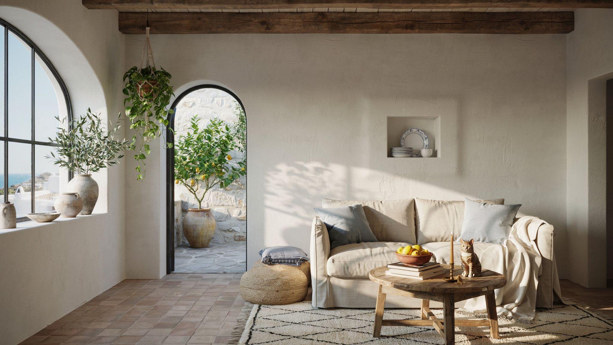 Mediterranean-style room with white walls, warm wood furniture, and blue accents in a bright sunlit interior.