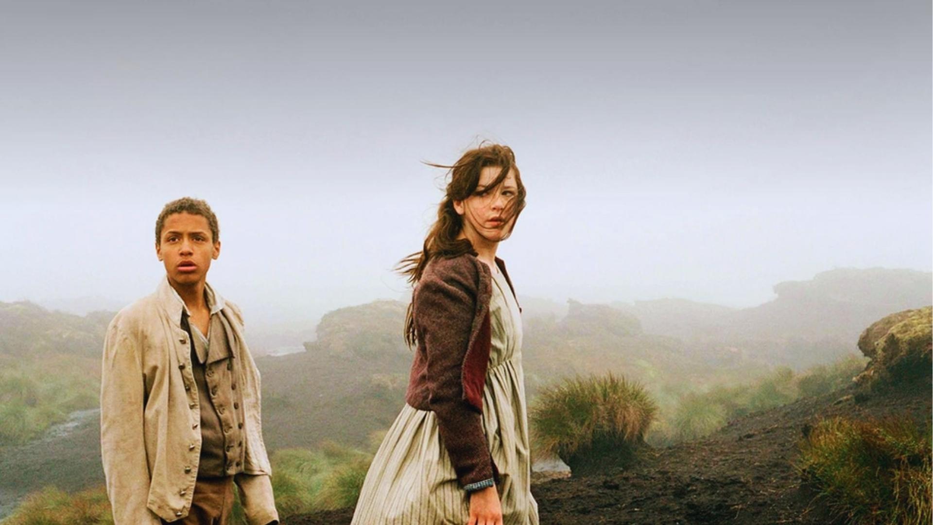 Young Heathcliff and Cathy on windswept foggy moors, iconic Wuthering Heights Yorkshire filming location.