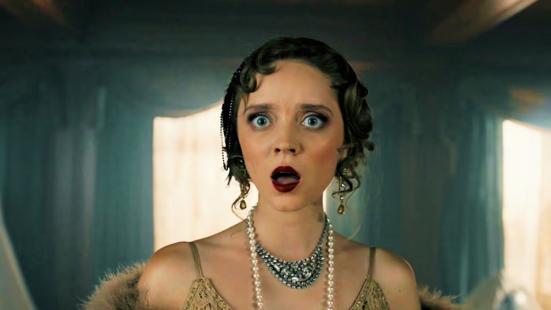 A flapper ghost in 1920s pearls and fur stares in shock inside a dimly lit mansion.