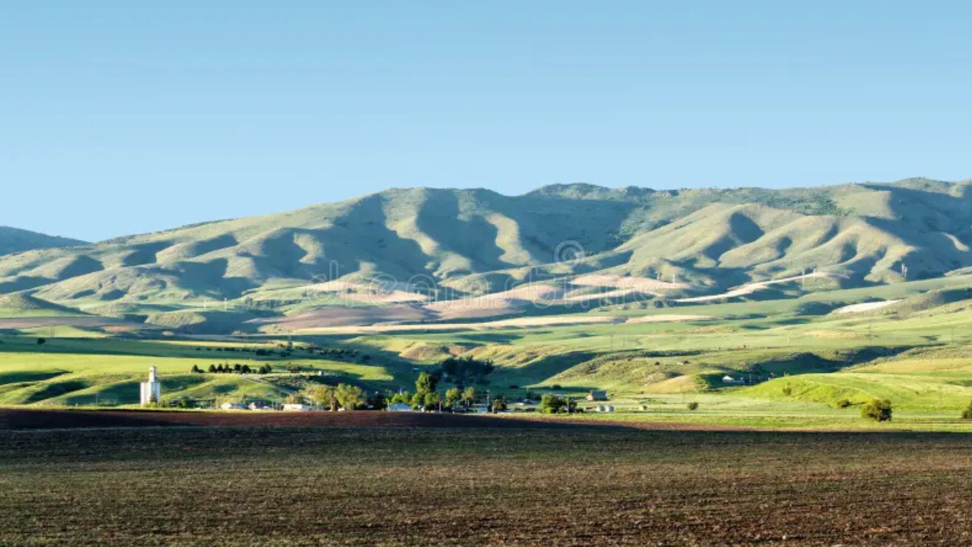 Expansive valley landscape with hills and fields, representing the rural setting of other filming locations from Napoleon Dynamite.