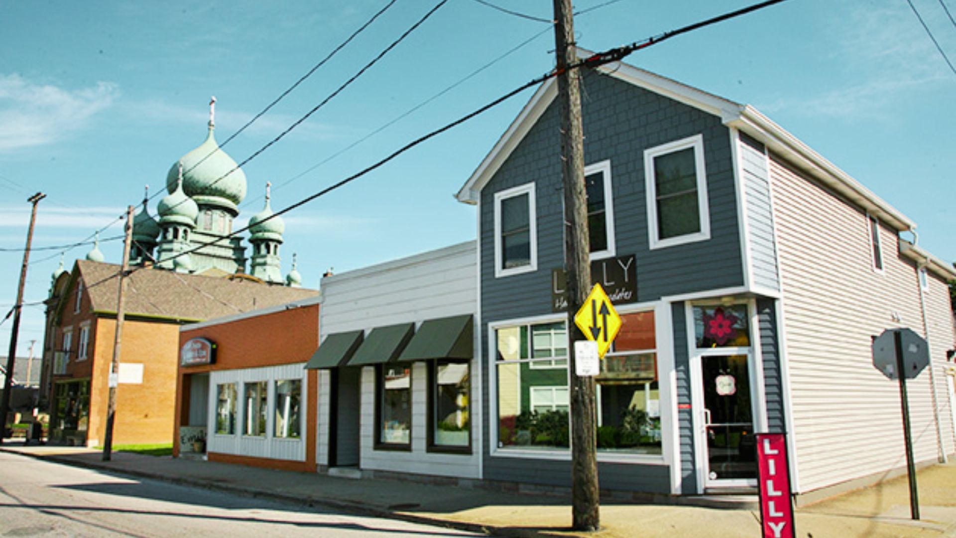 A quaint building next to a church, representing a filming site from the movie "Deer Hunter."