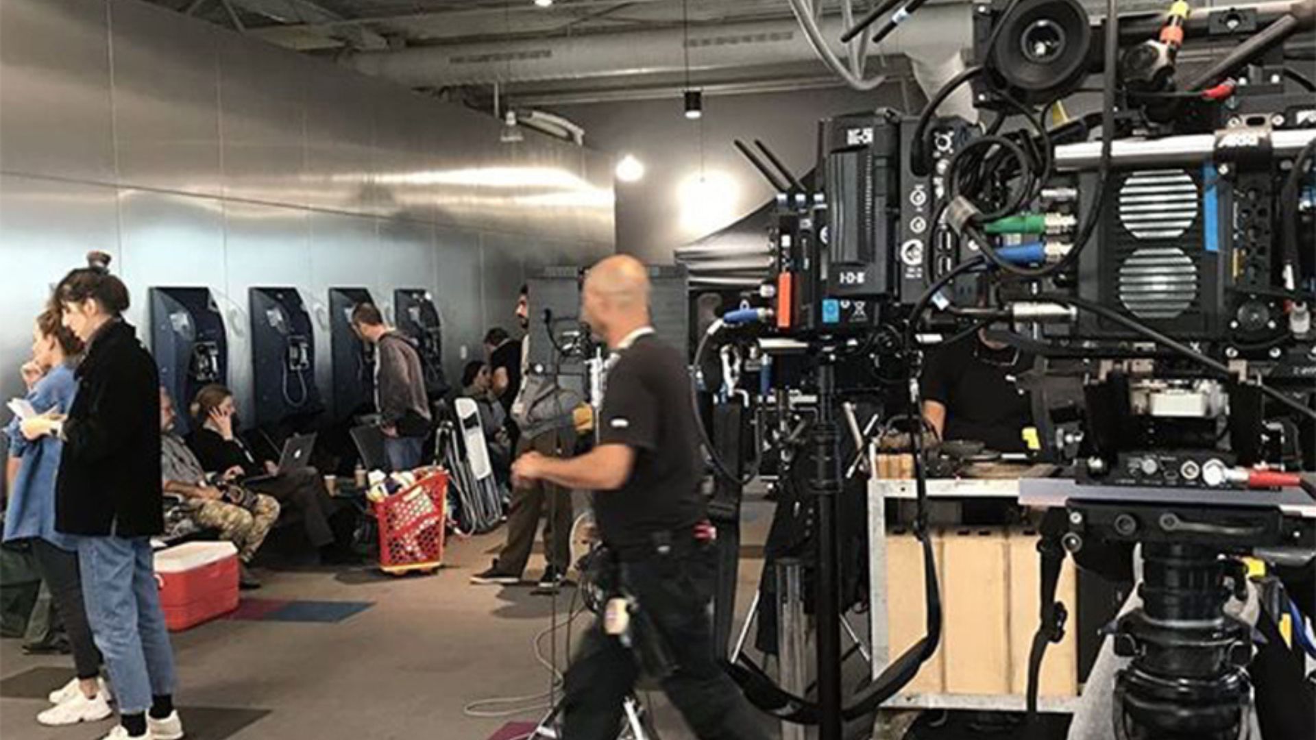 Behind-the-scenes view of the Tehran production crew working on set during filming in Greece.