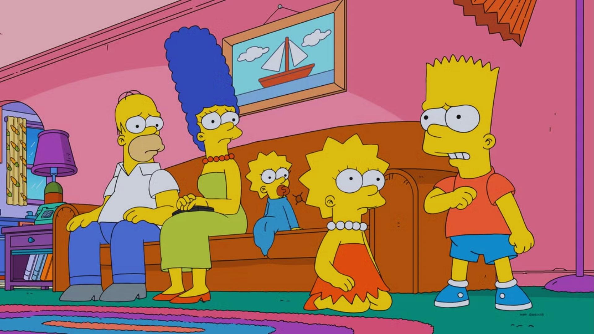 Simpsons family in living room: Homer, Marge, Maggie on brown couch with Lisa and Bart in front.