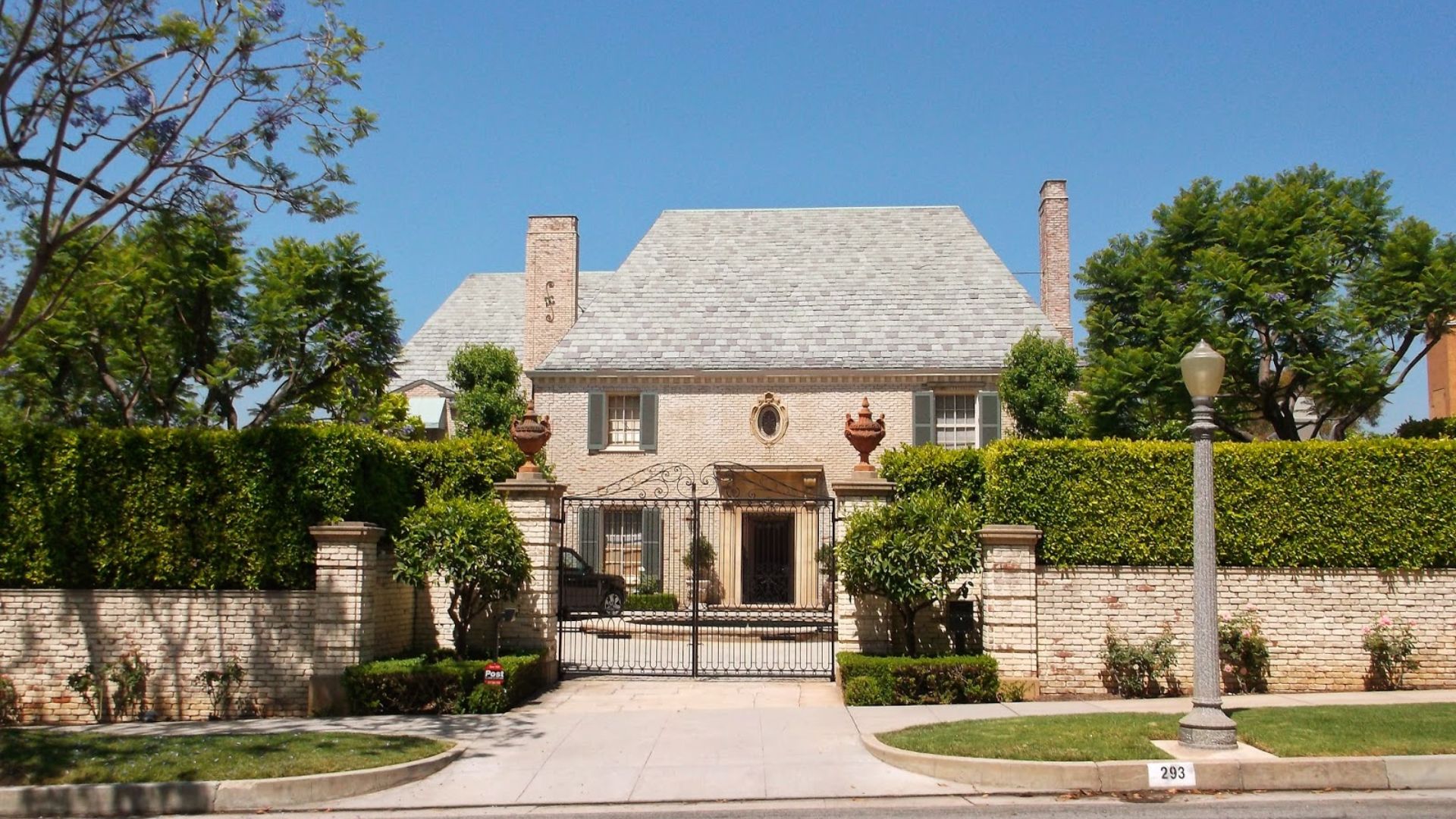 The Gilmore Mansion in frame during the day.