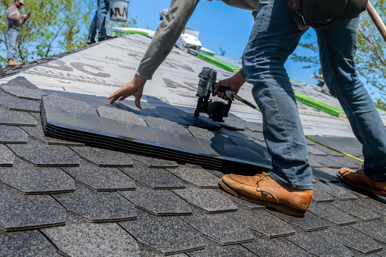 Professional fixing the roof
